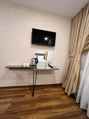 a room with a table with a tv on the wall at Nacre 360 in Istanbul