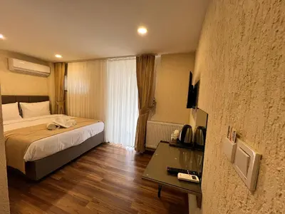 a hotel room with a bed and a table at Nacre 360 in Istanbul