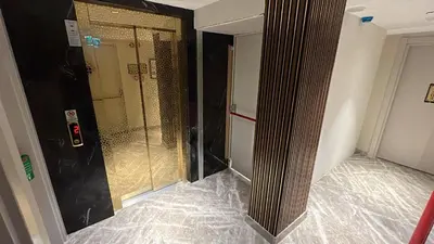 a shower with a glass door in a room at Espoir HOTEL in Istanbul