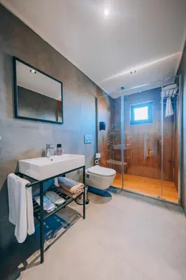 a bathroom with a sink and a toilet and a shower at The Green Park Sapanca in Sapanca