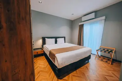 a bedroom with a bed and a large window at The Green Park Sapanca in Sapanca