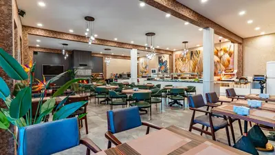 a dining room with tables and chairs at The Green Park Sapanca in Sapanca