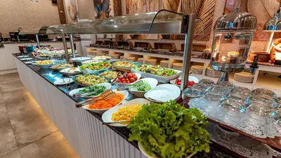 a buffet line with many different dishes of food at The Green Park Sapanca in Sapanca