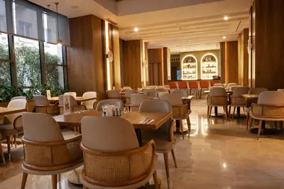 a dining room with tables and chairs and windows at Dosso Dossi Hotels & SPA Downtown in Istanbul