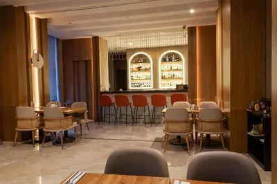 a restaurant with tables and chairs and a bar at Dosso Dossi Hotels & SPA Downtown in Istanbul