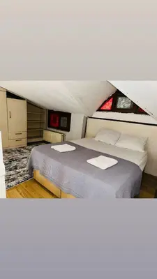 a bedroom with a large bed in a room at Yaman suit in Istanbul