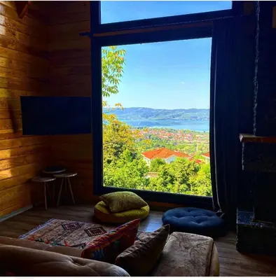 a room with a large window with a view at papatya in Sapanca