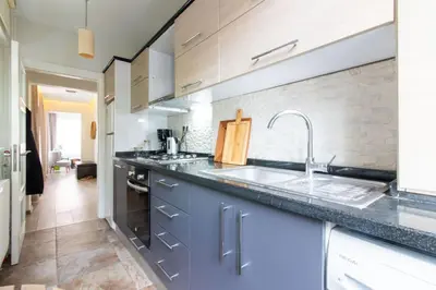 a kitchen with a sink and a counter top at Pretty Corner Flat with Abundant Light in Kadikoy in Istanbul