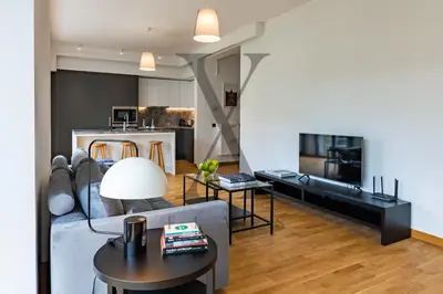 a living room with a couch and a table at X Flats Kaiser in Istanbul