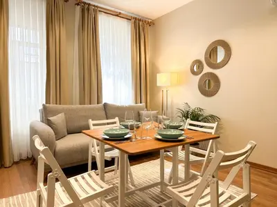 a living room with a table and a couch at ŞAHİN PERA SUİT 1 stylish 2Br 3Ac apartment near Istiklal street in Istanbul