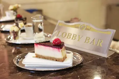 a piece of cake on a plate on a table at Halifaks Hotel in Istanbul