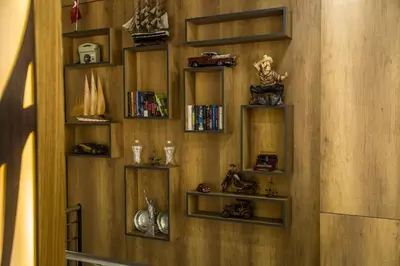 a room with wooden walls with wooden shelves with books at Zengin City Hotel in Istanbul