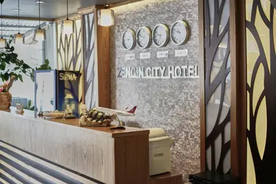 a lobby of a hotel with a sign on a brick wall at Zengin City Hotel in Istanbul
