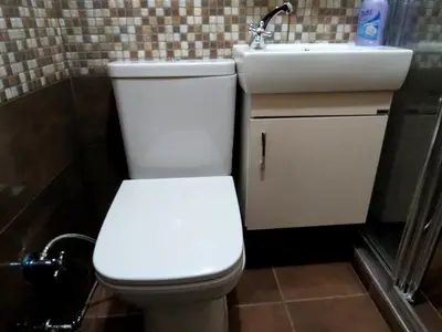 a bathroom with a white toilet and a sink at Istanberry - Pera Apartments in Istanbul