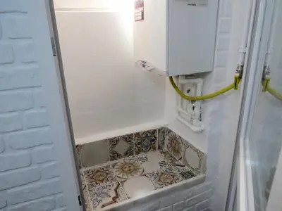 a small bathroom with a shower with a tiled floor at Istanberry - Pera Apartments in Istanbul