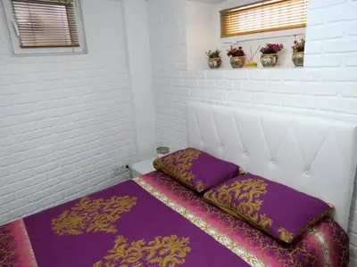 a room with a bed with two pillows on it at Istanberry - Pera Apartments in Istanbul
