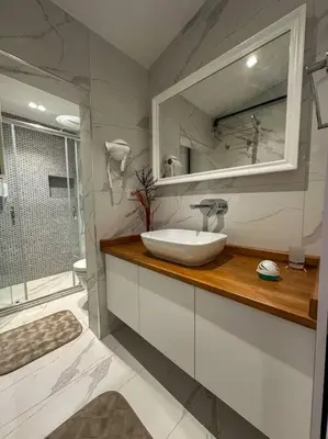 a bathroom with a sink and a mirror at ŞAHİN PERA SUİT3 Central location 2 Br 3 Ac great apartment in Istanbul