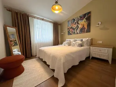 a bedroom with a bed and a large window at ŞAHİN PERA SUİT3 Central location 2 Br 3 Ac great apartment in Istanbul