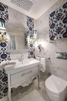 a bathroom with a sink and a toilet and a mirror at Excellent Apartments Galata in Istanbul