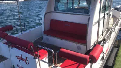 a boat with red seats on the back of it at Vip Bosphorus Tour in Istanbul