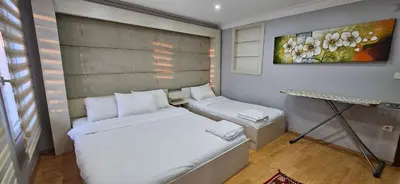 a small room with a bed and a table at TAKSIM SUITE Apartment in Istanbul