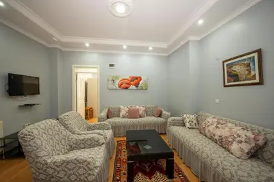 a living room with two couches and a tv at TAKSIM SUITE Apartment in Istanbul