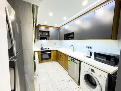 a kitchen with a washer and dryer in it at Sisli Apartments Holiday441 in Istanbul