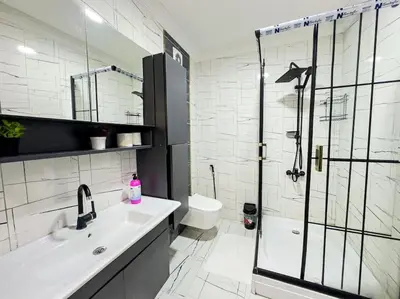 a bathroom with a shower and a sink and a toilet at Holiday 5 4 Sisli 3 in Istanbul