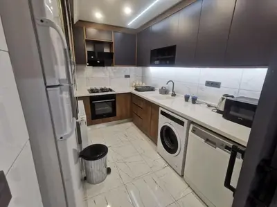 a kitchen with a washer and dryer in it at Holiday 5 4 Sisli 3 in Istanbul