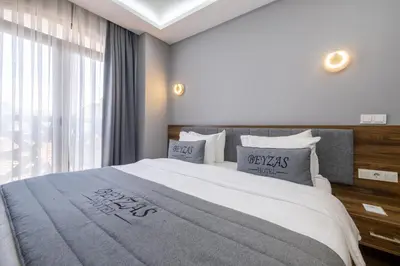 a bedroom with a large bed and a window at Beyzas Hotels & Suites in Istanbul