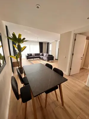 a living room with a black table and chairs at Sense Suite Residence-19 in Istanbul