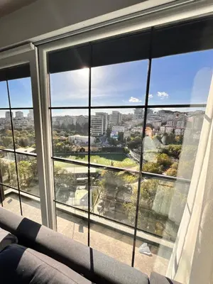 a large window with a view of a city at Sense Suite Residence-19 in Istanbul