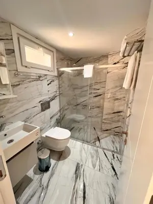 a bathroom with a toilet and a sink at Sense Suite Residence-19 in Istanbul