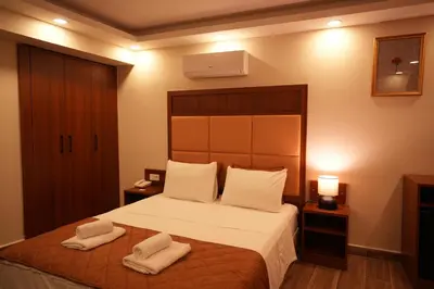a bedroom with a bed with two towels on it at Keeper in Istanbul
