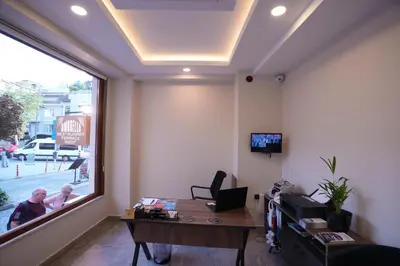 an office with a desk and a large window at Keeper in Istanbul