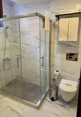 a shower stall in a bathroom with a toilet at Keeper in Istanbul
