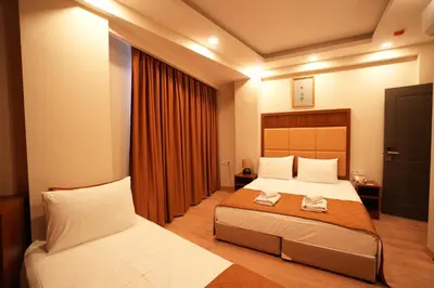 a hotel room with two beds and a window at Keeper in Istanbul