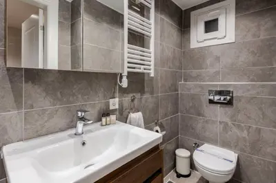 a bathroom with a sink and a toilet at Cute Private Garden 2BD2Bath Quaint Home! #366 in Istanbul
