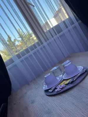 a pair of purple mugs sitting on a tray next to a window at Özdemir Apart - Sultanahmet in Istanbul