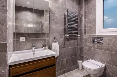 a bathroom with a sink and a toilet at Bright Charming Modern 3BD2Bath Balcony! #367 in Istanbul