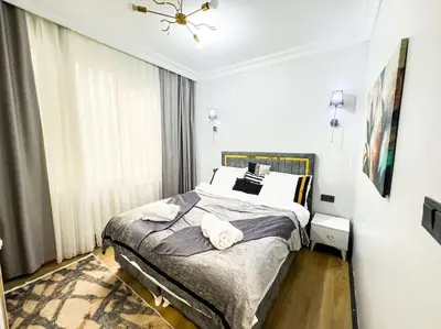 a bedroom with a bed with two towels on it at Sisli apartment 6 4 4 in Istanbul