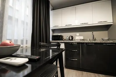 a kitchen with a counter with a bowl on a table at opera wall suite in Istanbul