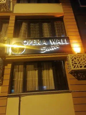 a sign on the side of a building at opera wall suite in Istanbul