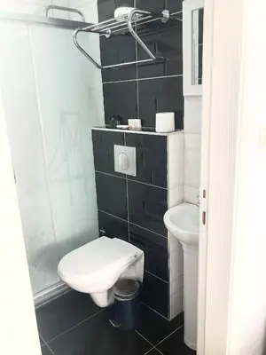 a bathroom with a toilet and a sink at Taksim Castle Suites in Istanbul