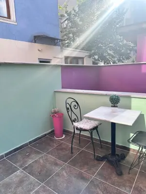 a table and chairs in a room with purple and purple walls at Taksim Castle Suites in Istanbul