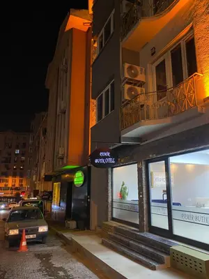 a car parked in front of a building at night at Pamir Butik Otel in Bursa