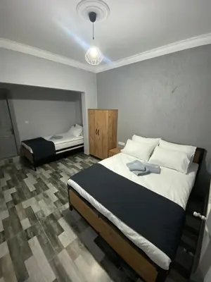 a bedroom with two beds in a room with at Pamir Butik Otel in Bursa