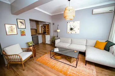 a living room with a couch and a table at A Cozy, Quiet Home with Great View in City Center in Istanbul