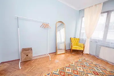 a dressing room with a mirror and a yellow chair at A Cozy, Quiet Home with Great View in City Center in Istanbul