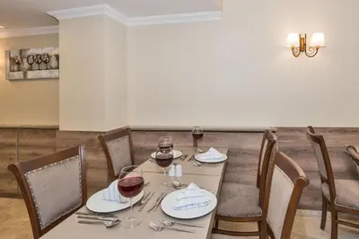 a table with two glasses of wine on it at Alphonse Hotel in Istanbul